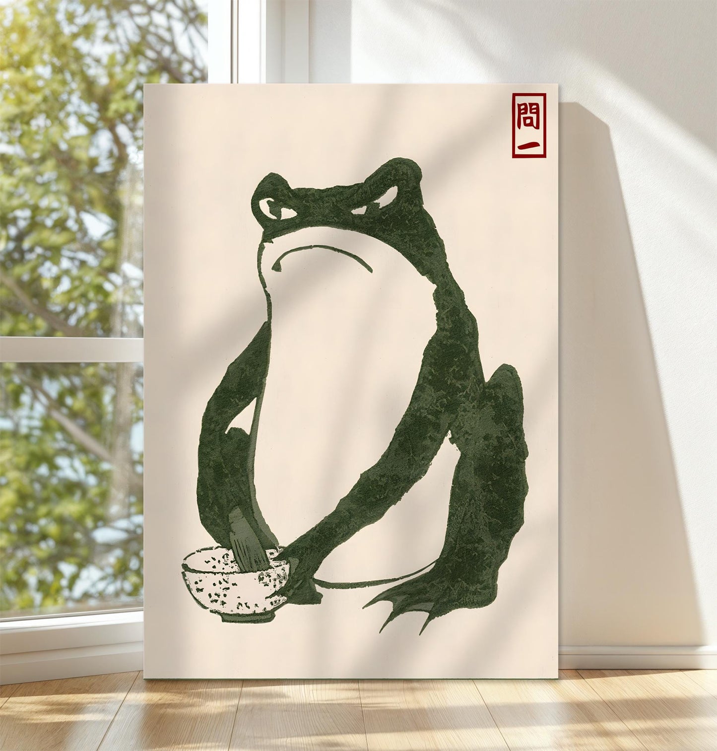 Minimalist Japanese frog art print on canvas featuring a green frog holding a rice bowl with a traditional red seal. This nature-inspired wall decor brings a calming, Zen vibe to any space. Perfect for meditation rooms, Japanese-themed interiors